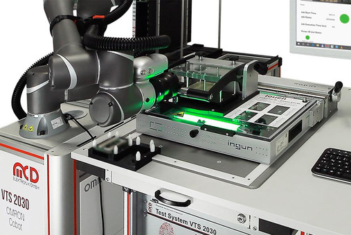 Test fixture is operated fully automatically by a cobot